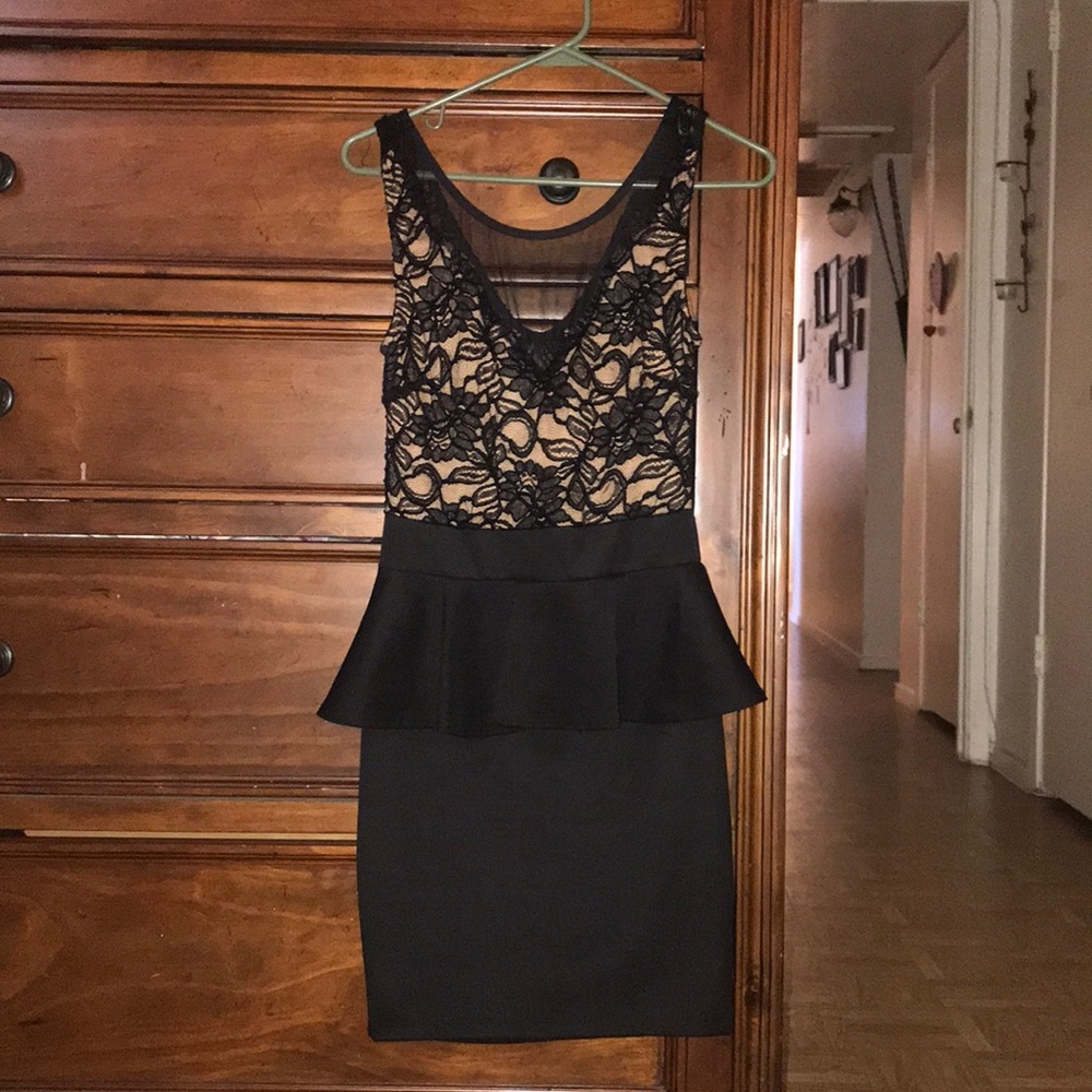 Im selling this black lace dress.